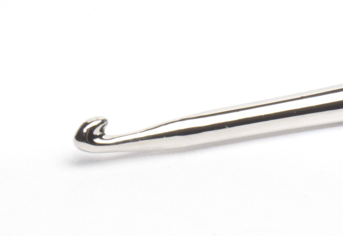 Diane cap in use with stylist pulling hair through hole for accurate highlights