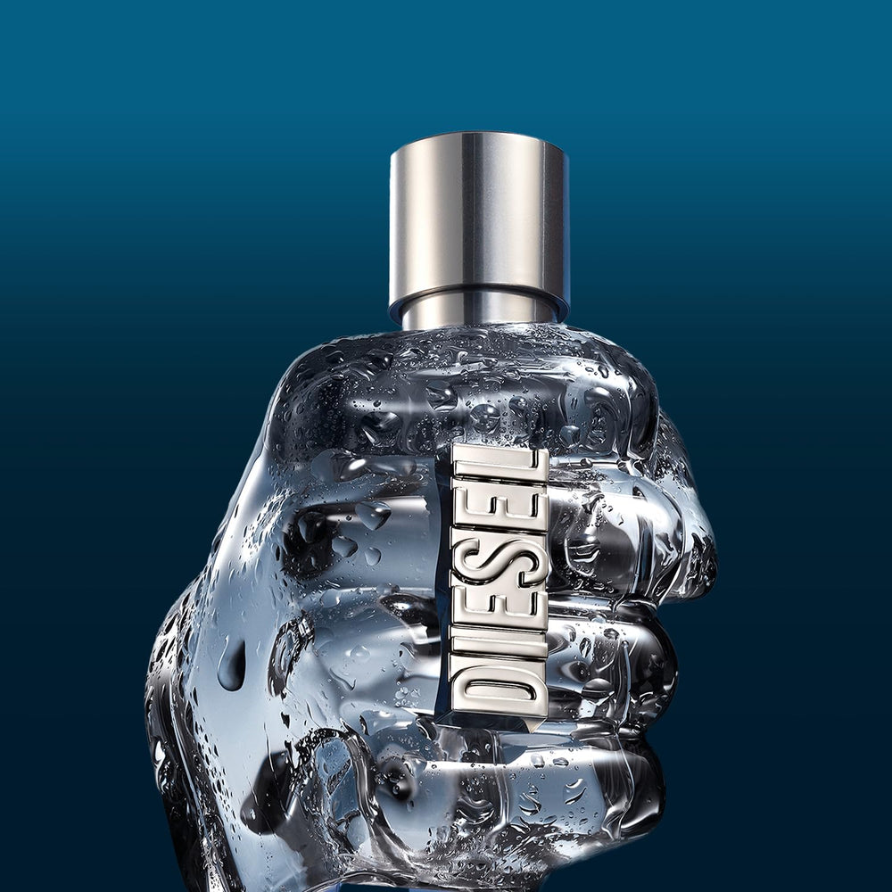 Diesel bottle held in hand to show 1.2 fl oz scale and travel convenience