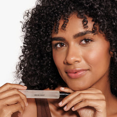 DIME Malibu Night spray in hand demonstrating purse-ready portability and easy reapplication