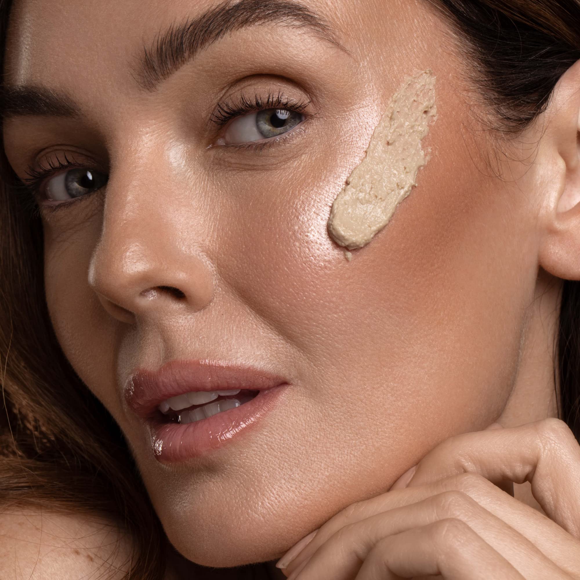 DIME mask applied on model cheek showing pore-clearing effect