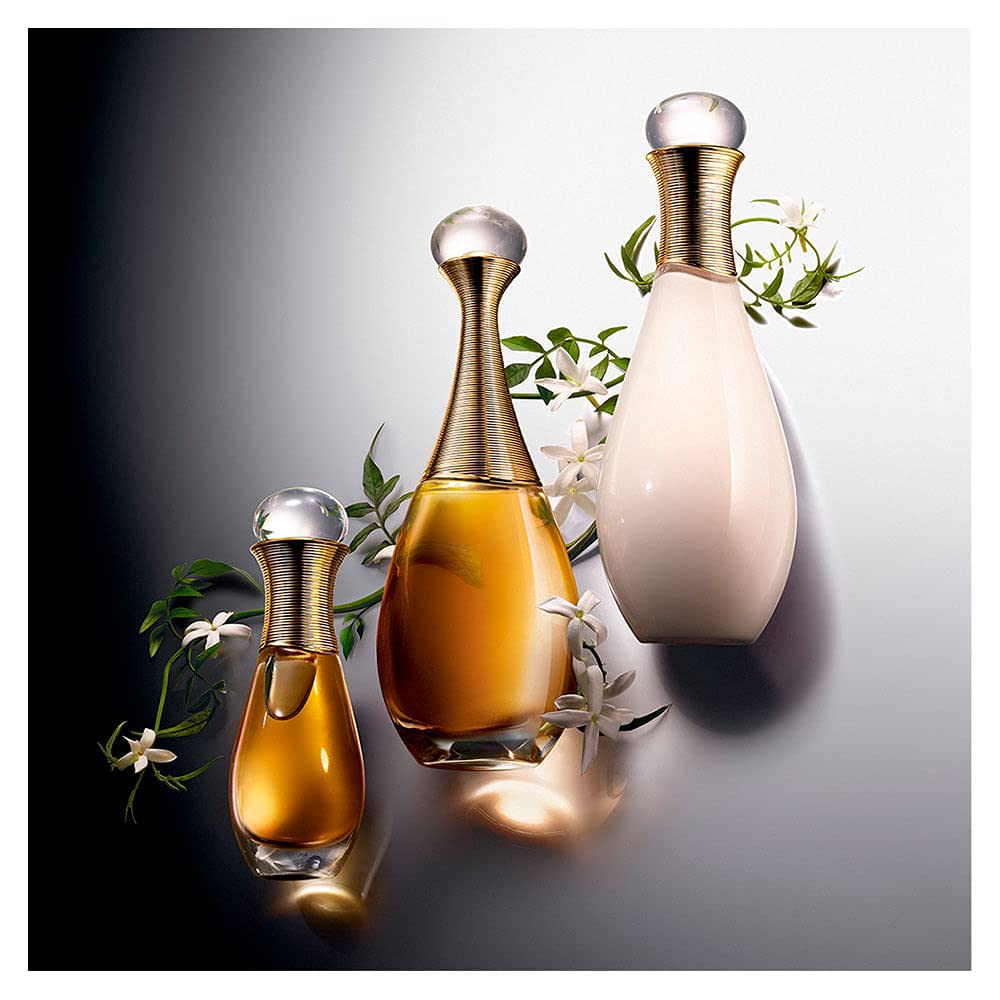 Dior J'Adore held in hand to show 1.7 oz scale and travel-friendly convenience