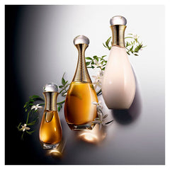 Dior J'Adore held in hand to show 1.7 oz scale and travel-friendly convenience