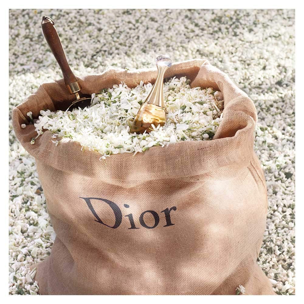 Dior J'adore on vanity in evening setting suggesting glamorous wear
