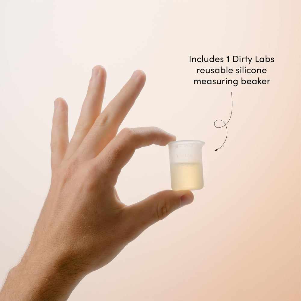 Dirty Labs bottle beside everyday items illustrating 375mL capacity and space-saving benefit