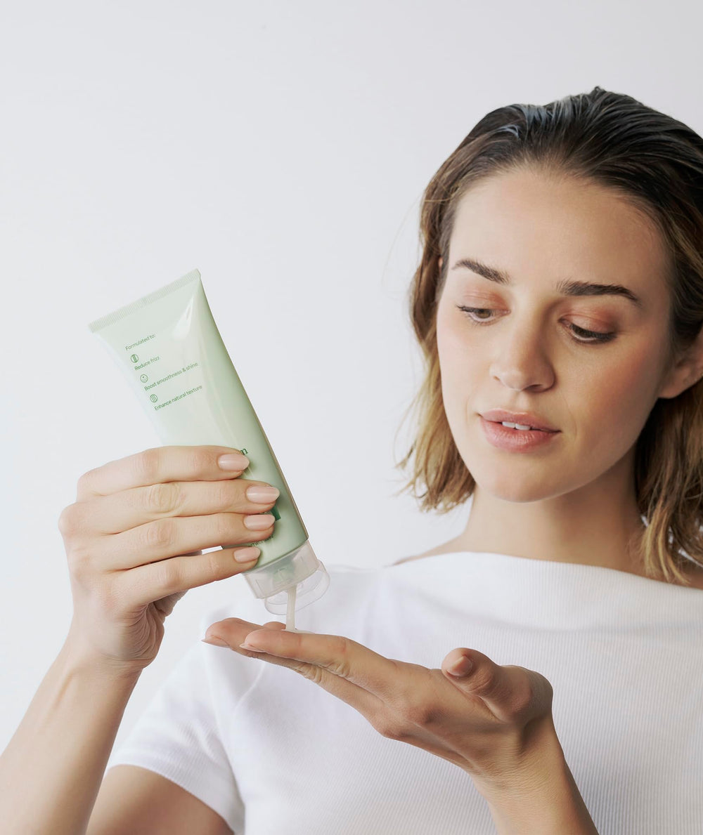 Divi cream in bathroom during styling routine promoting easy use