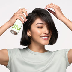 divi travel-size 1.7oz held in hand for convenient on-the-go refresh