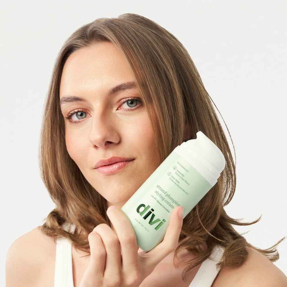 divi cream used with blow dryer illustrating heat protection benefit