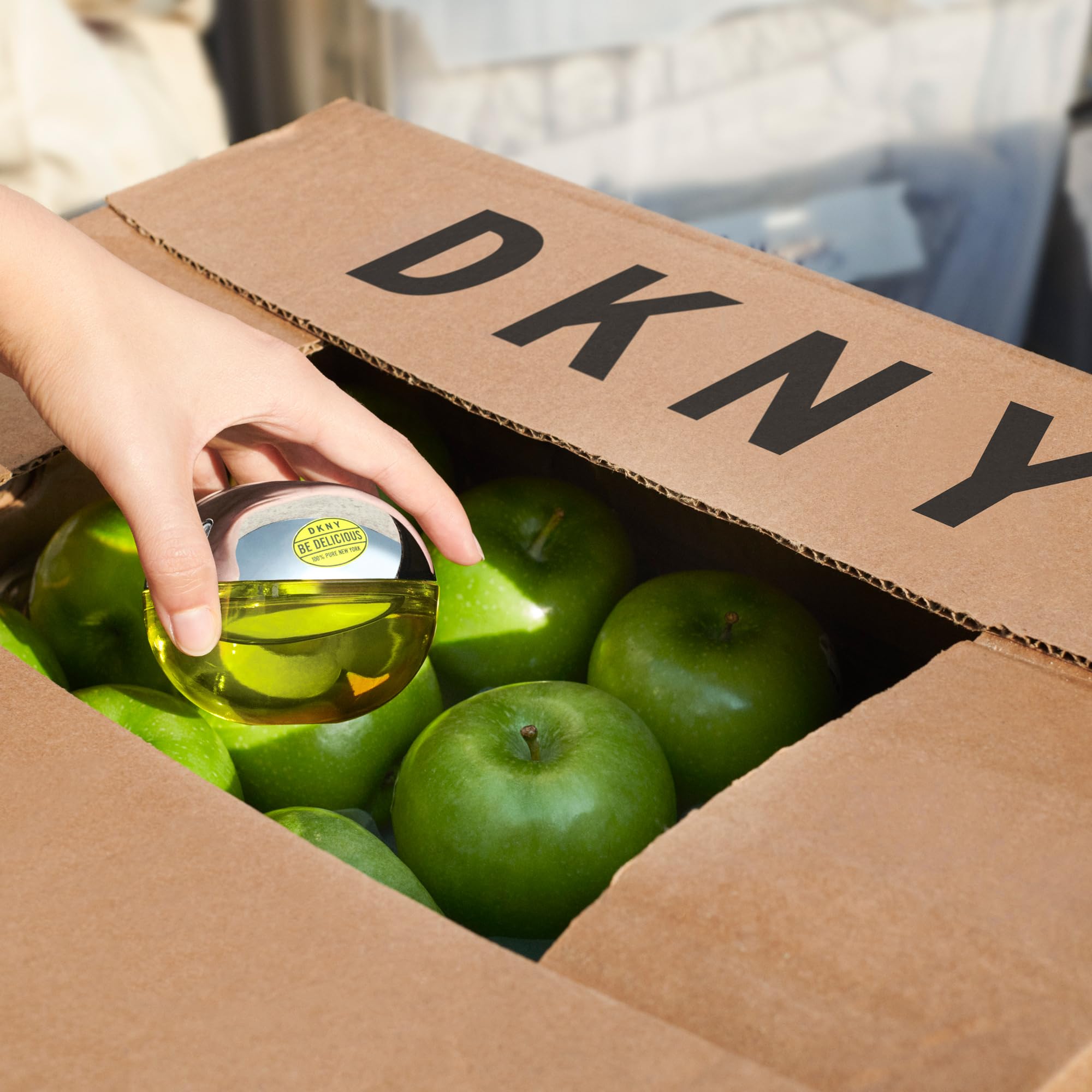 DKNY composition with apple and magnolia close-up emphasizing fresh notes