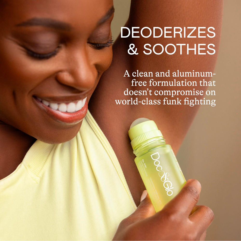 Doc & Glo roll-on applying underarm for quick midday refresh