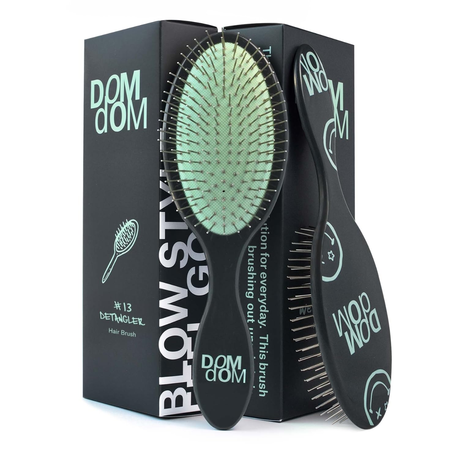 Dom Dom detangling brush front view showing green finish and ergonomic shape for comfortable grip