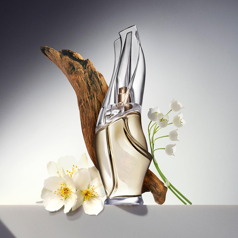 Donna Karan Cashmere Mist individual sprays lined up for convenient use