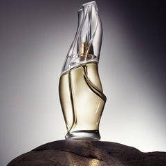 Donna Karan Cashmere Mist being sprayed from hand for on-the-go refresh
