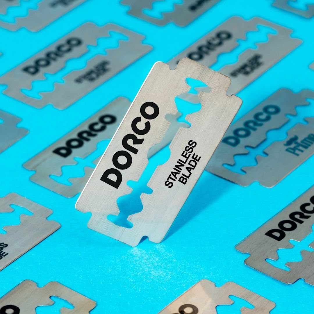 DORCO blade beside coin showing compact DE size for compatibility