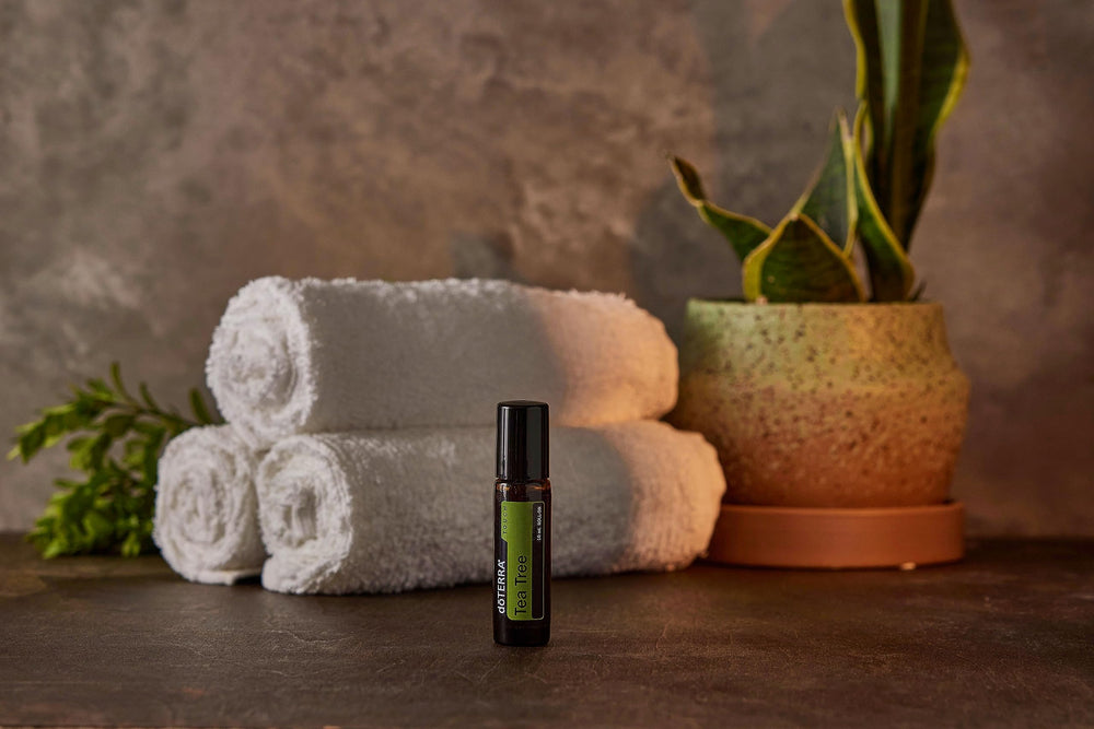 doTERRA Melaleuca Touch with other essentials flatlay for coordinated routine benefit