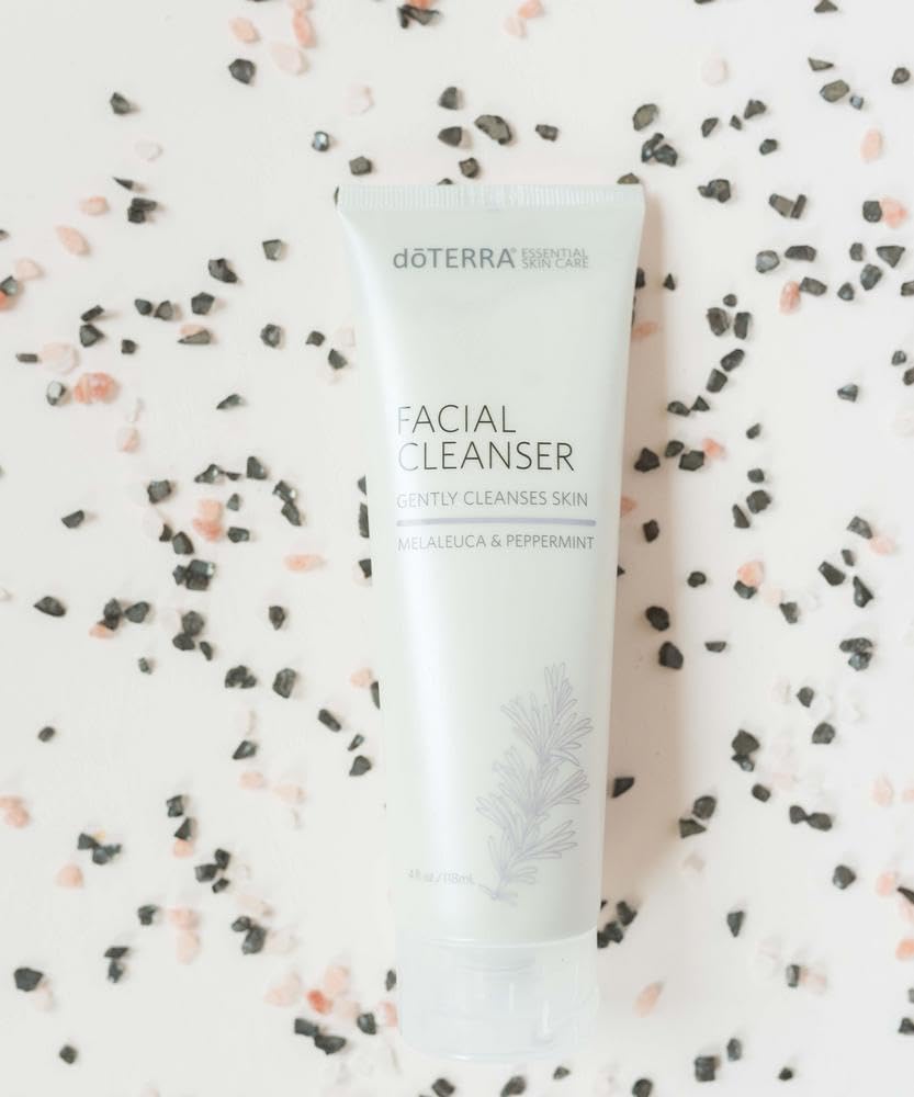 doTERRA facial cleanser 4 oz next to hand to show scale and travel-friendly size