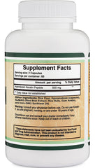 Hand holding several Double Wood keratin capsules demonstrating serving size and ease