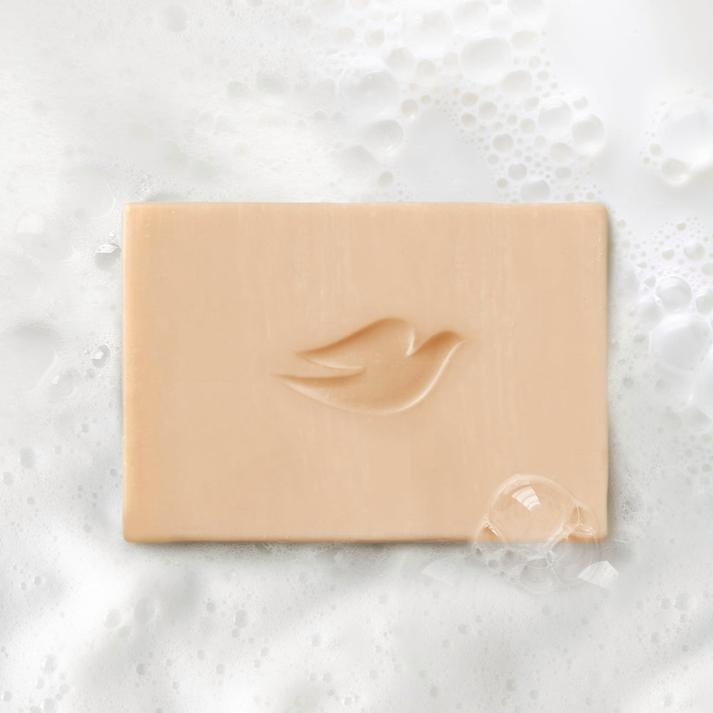 Dove coconut milk and lychee ingredients styled to convey natural scent benefit