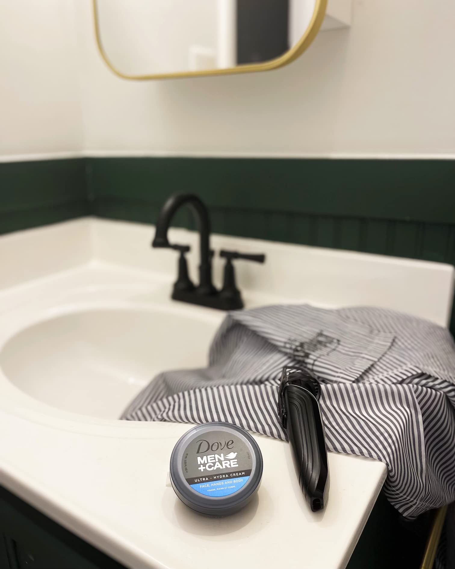 Dove Men+Care jar next to wallet to show travel-friendly size and convenient portability
