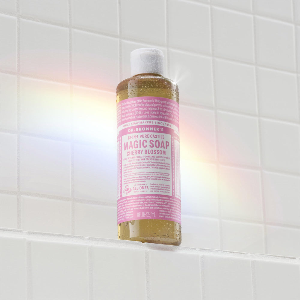 Dispensing Dr. Bronner's soap from bottle into hand demonstrating concentrated use