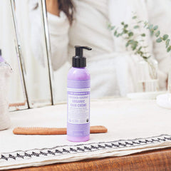 Dr. Bronner's in-hand application demonstrating smooth distribution for manageability
