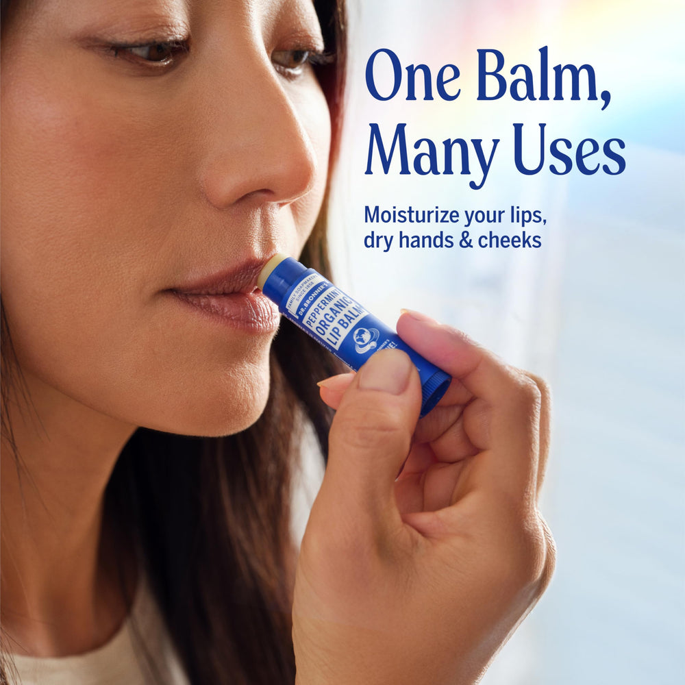 Dr. Bronner's balm applied to cuticle and hand for dry skin protection
