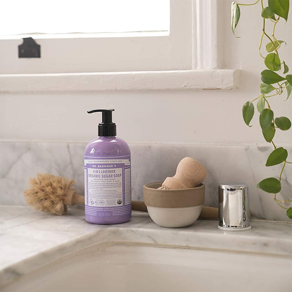 Dr. Bronner's tea tree soap lather on palm showing cleansing foam and clarity
