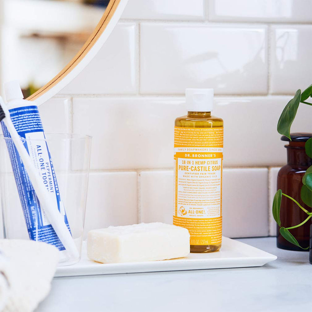 Dr. Bronner's Tea Tree soap pouring to show texture and concentrated cleaning benefit