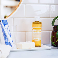 Dr. Bronner's Tea Tree soap pouring to show texture and concentrated cleaning benefit
