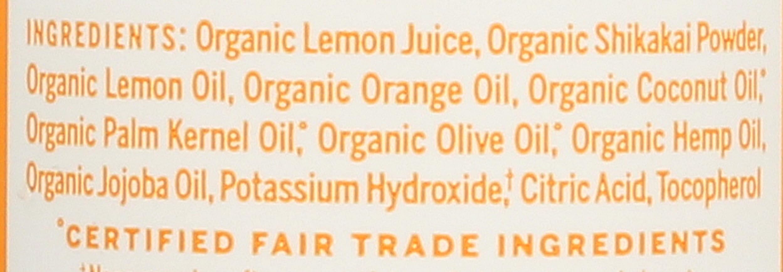 Close-up texture of the conditioning rinse, Dr. Bronner's shows smooth slip benefit