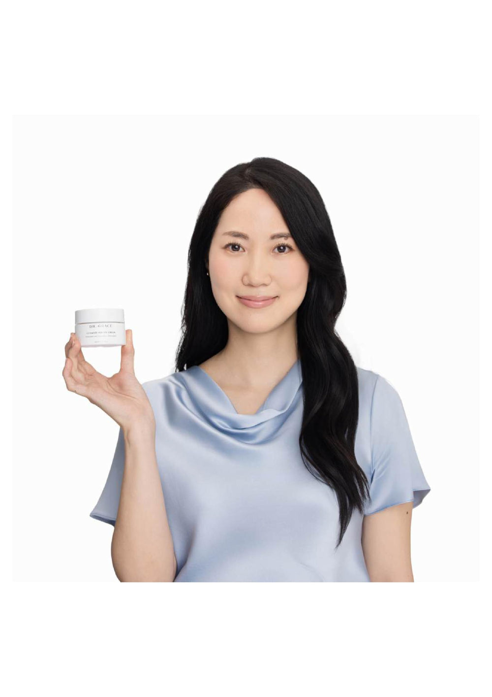 Dr. Grace cream on hand showing easy application and fast absorption benefit