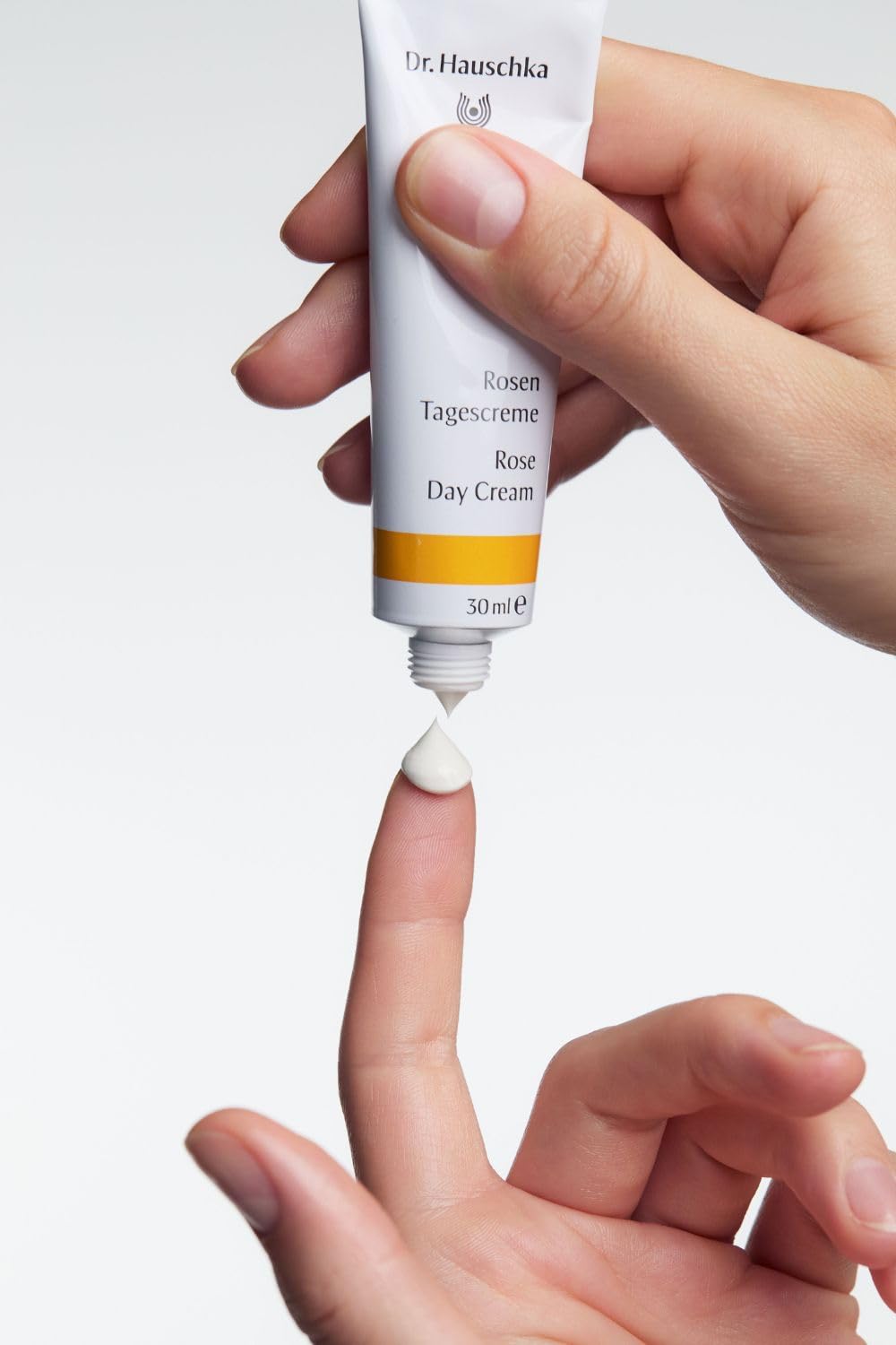 Dr. Hauschka application pressing motion on skin demonstrating gentle absorption benefit