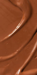 Dr. Hauschka pump dispensing bronzing tint illustrating controlled, mess-free application