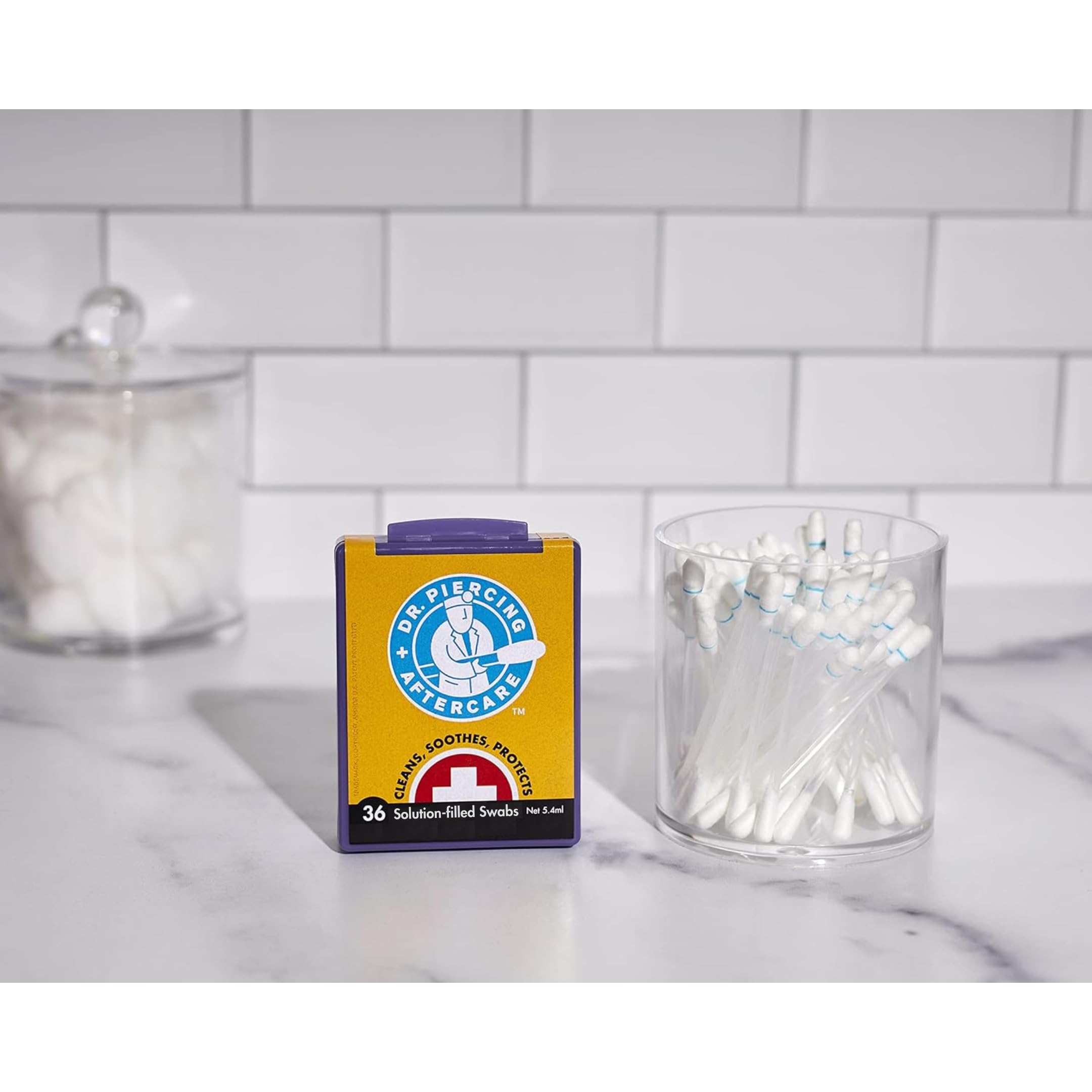 Dr. Piercing Aftercare swab in hand to show size and quick single‑use convenience