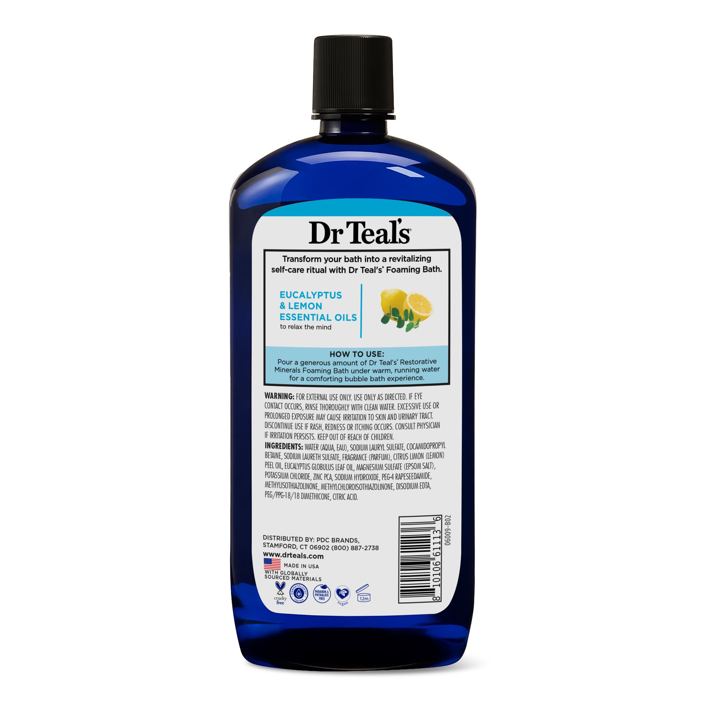 Dr Teal's bottle next to towel and candle for self-care ritual benefit