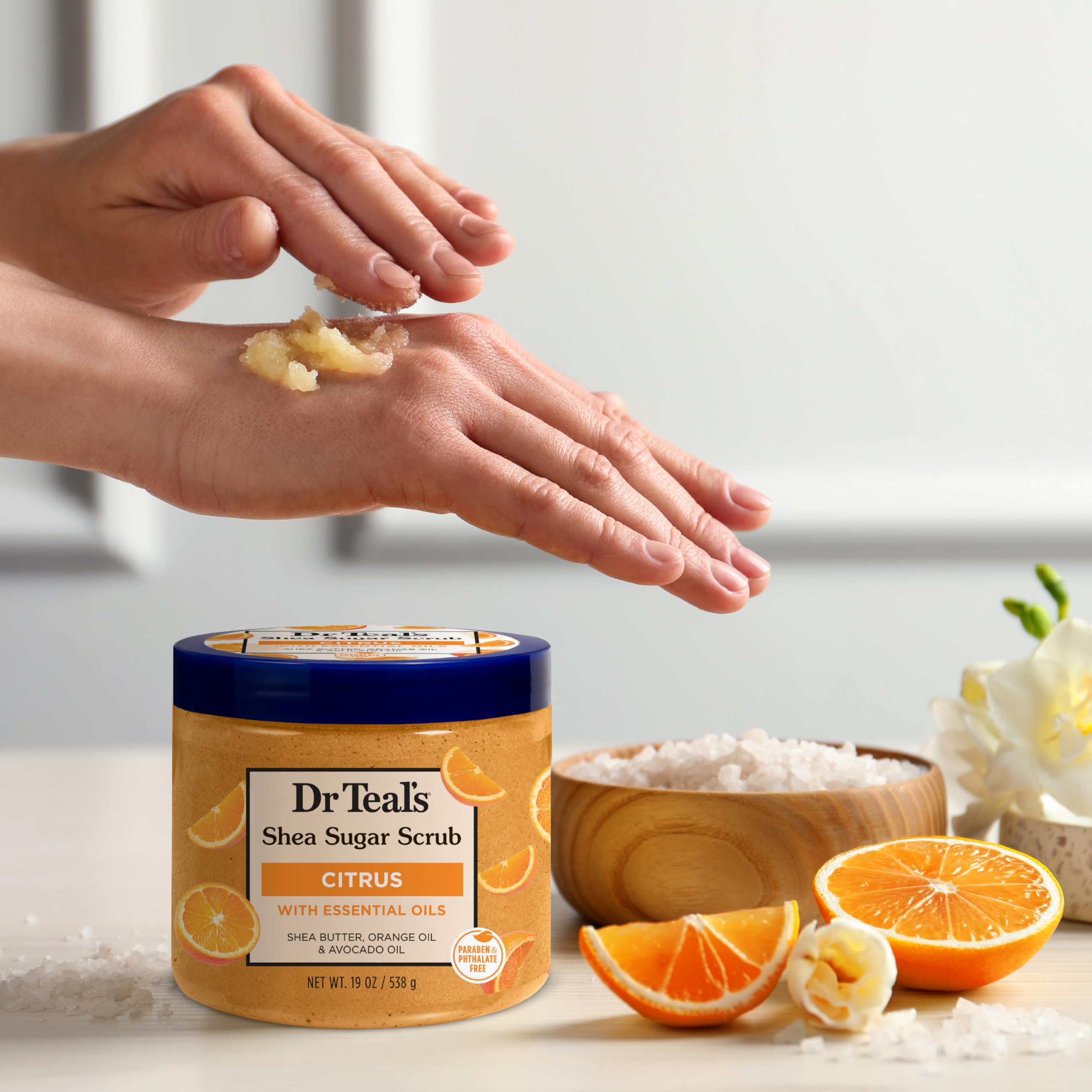 Dr Teal's product in hand showing 19 oz size and portioning benefit