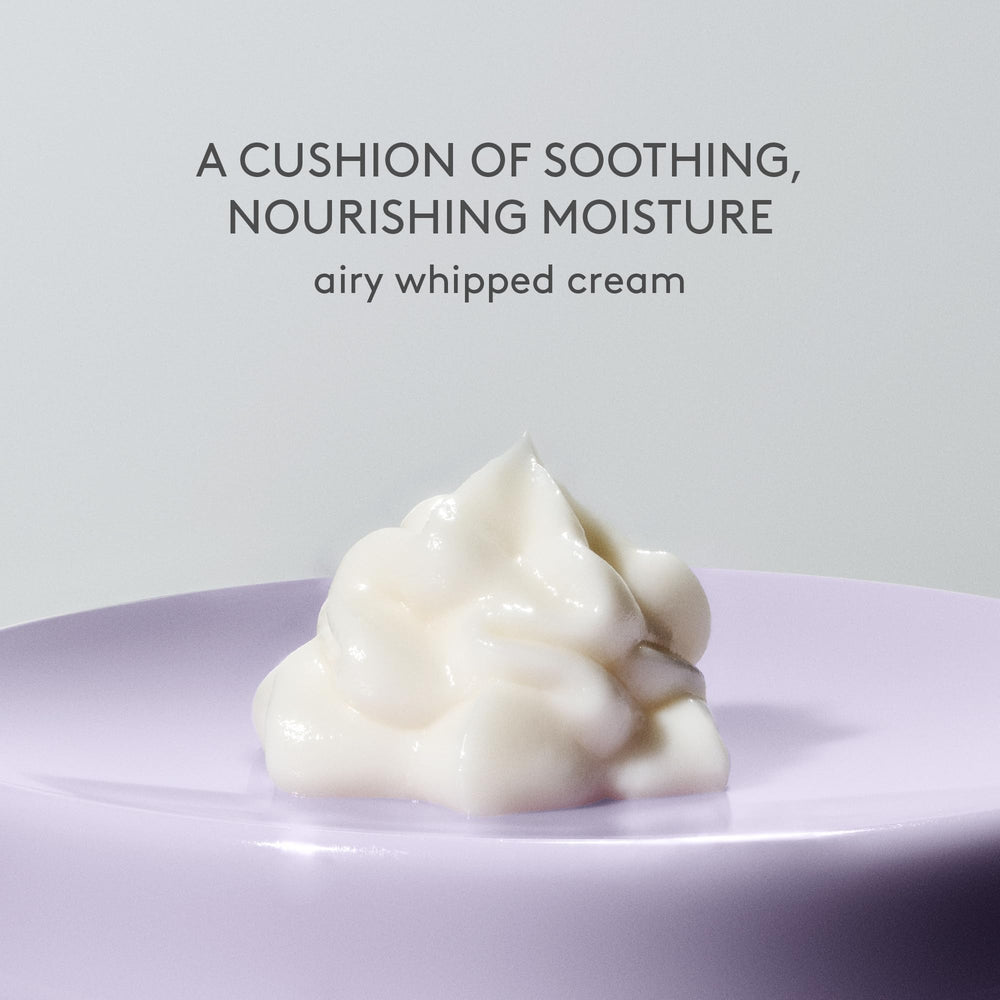 Drunk Elephant cream being smoothed on hand to show quick hydration benefit