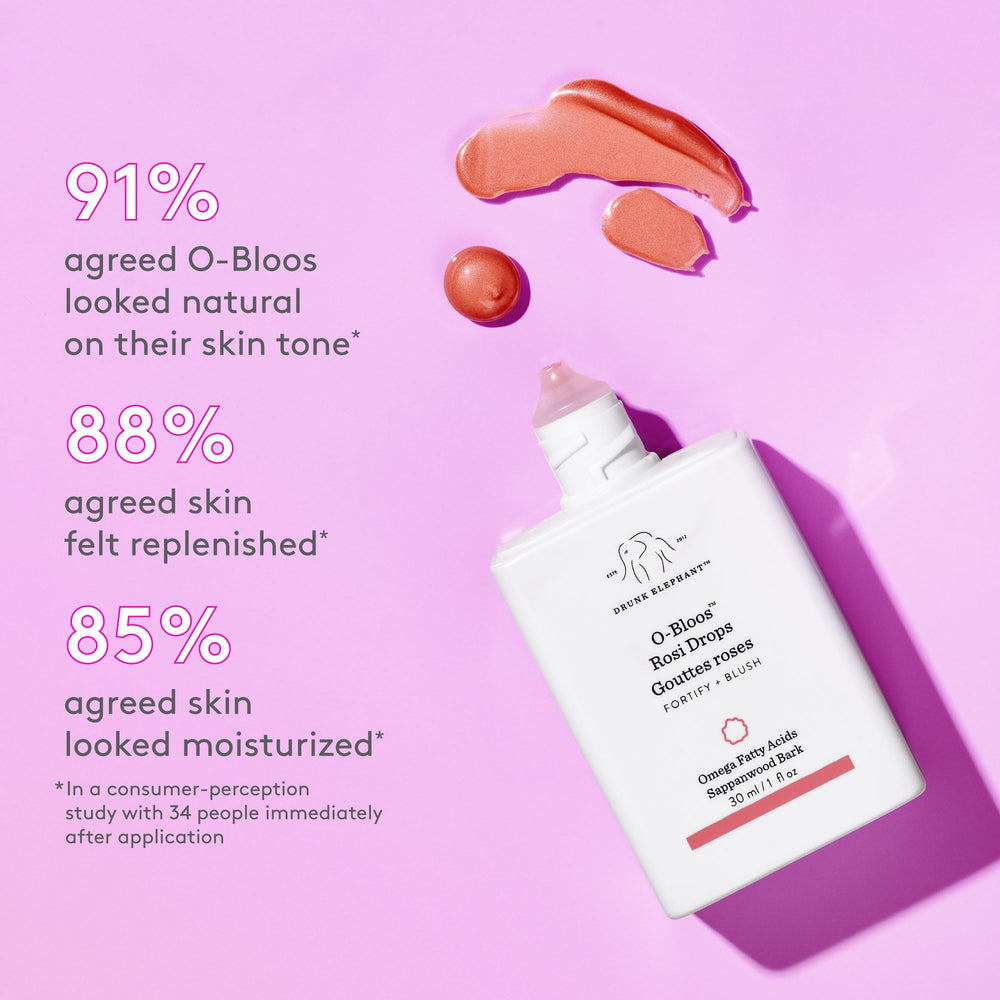 Drunk Elephant peachy-pink serum swatched on skin showing watercolor texture and natural blend benefit