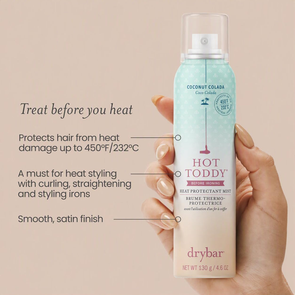Close-up of Drybar Hot Toddy label highlighting heat-protectant benefits and scent
