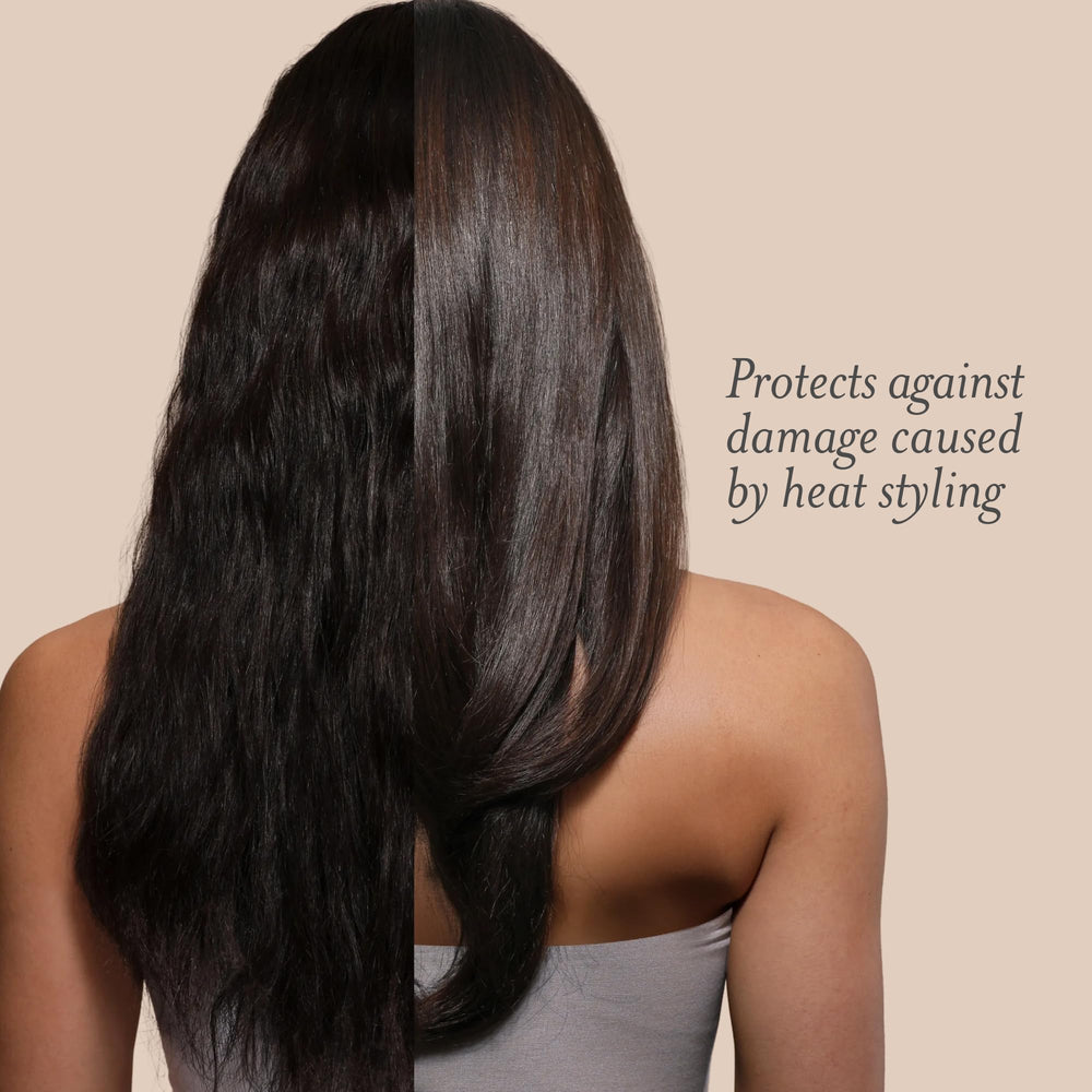 Drybar Hot Toddy mist spraying over hair demonstrating even protection before styling