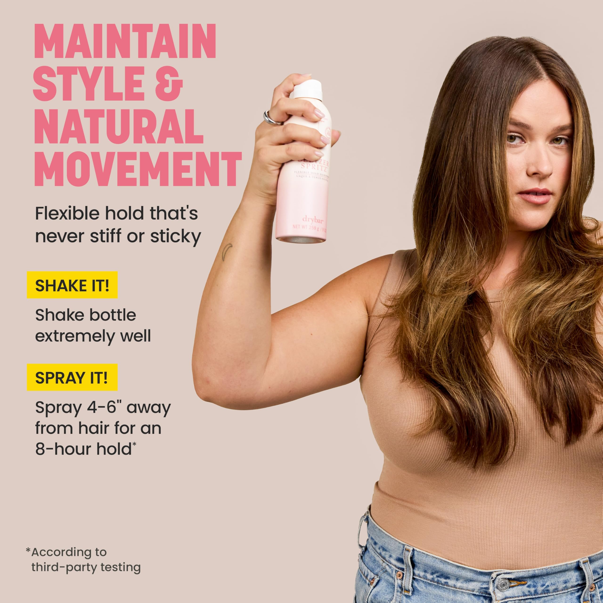 Drybar bottle held in hand showing ergonomic size and easy application