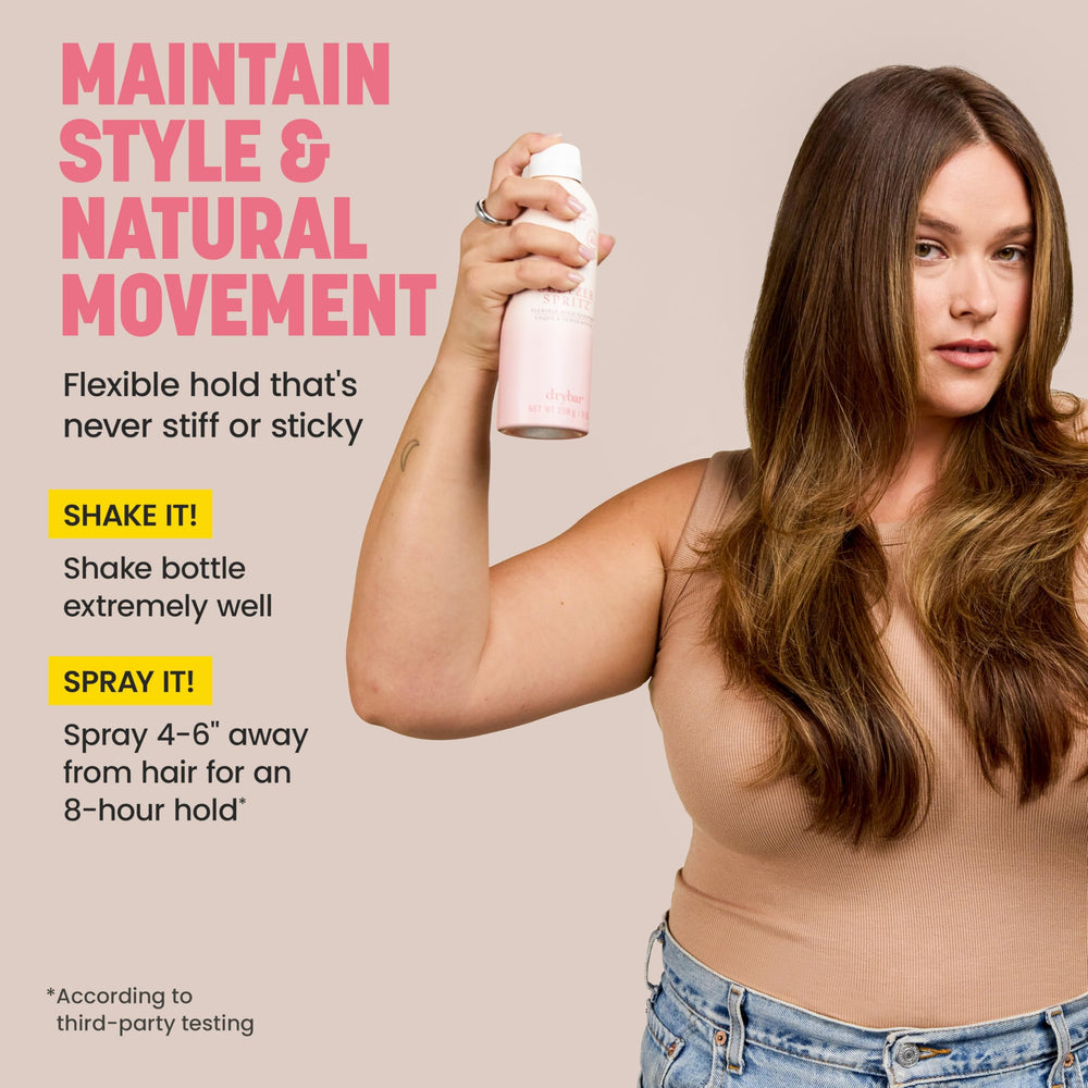Drybar bottle held in hand showing ergonomic size and easy application