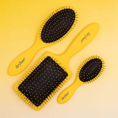 Drybar Super Lemon Drop detangling wet hair demonstrating gentle knot removal without breakage