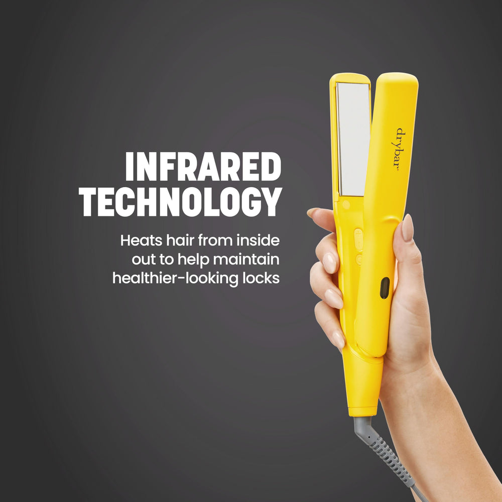 Drybar iron in hand styling hair for quick one-pass straightening benefit