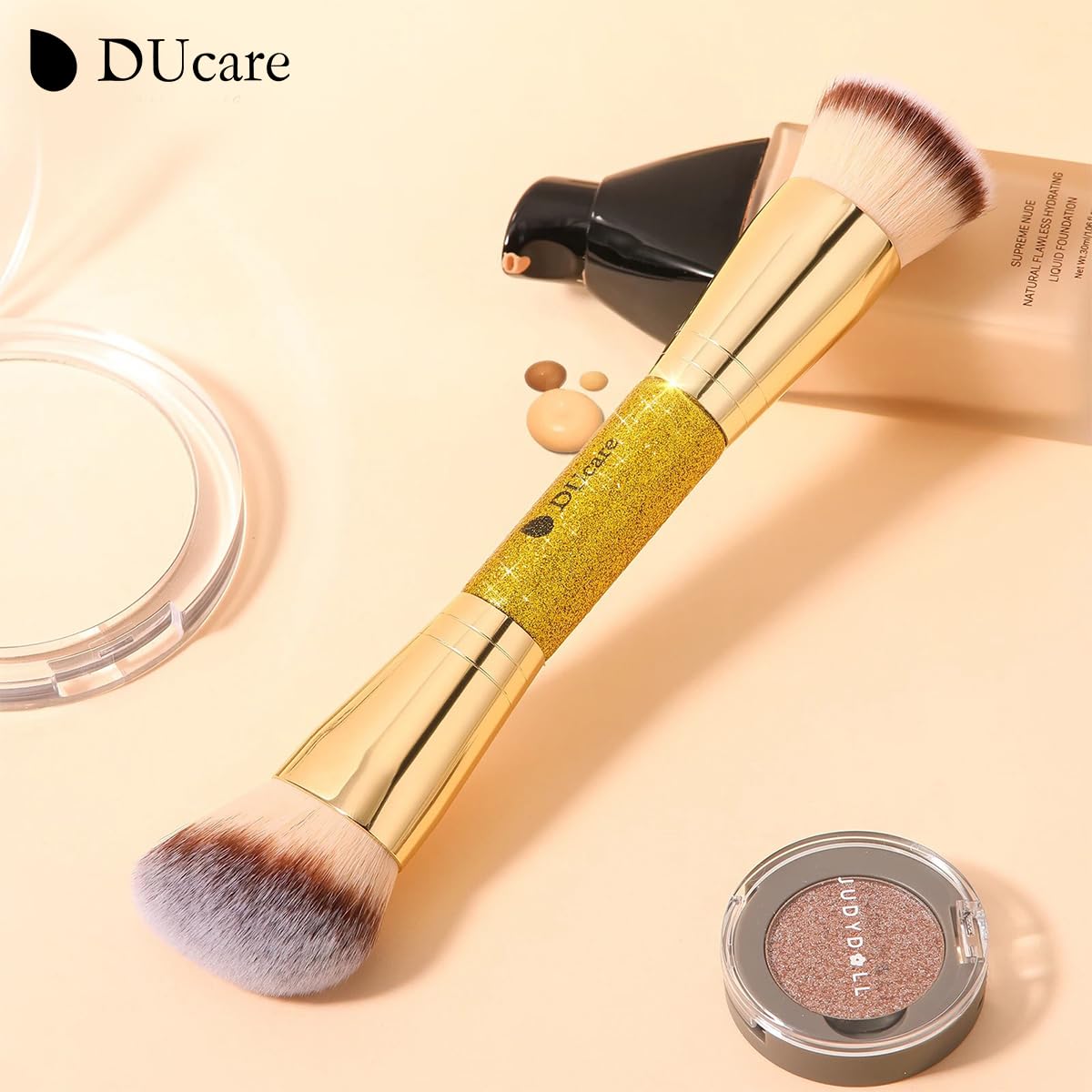 DUcare brushes held in hand for scale to display compact, portable size