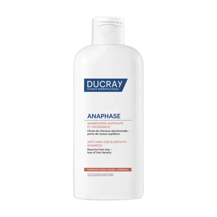 Ducray Anaphase+ cream shampoo lathered in hands demonstrating gentle foaming benefit