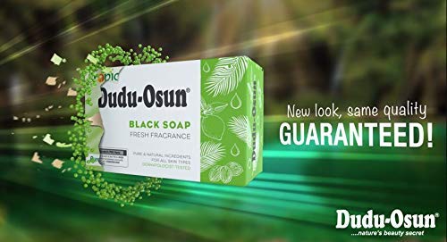 Dudu-Osun bar in hand illustrating size and easy use for personal or professional routines