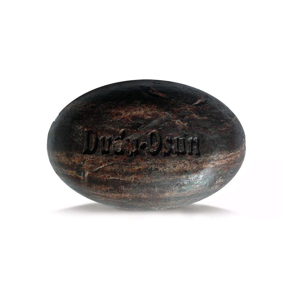 Dudu-Osun texture close-up revealing natural grain and dense lather potential for cleansing