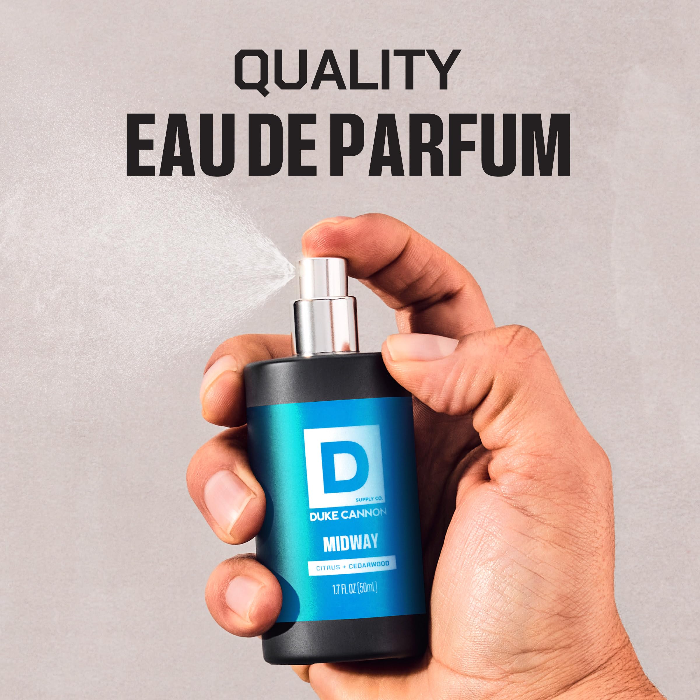 Duke Cannon bottle held in hand demonstrating Midway travel-friendly size