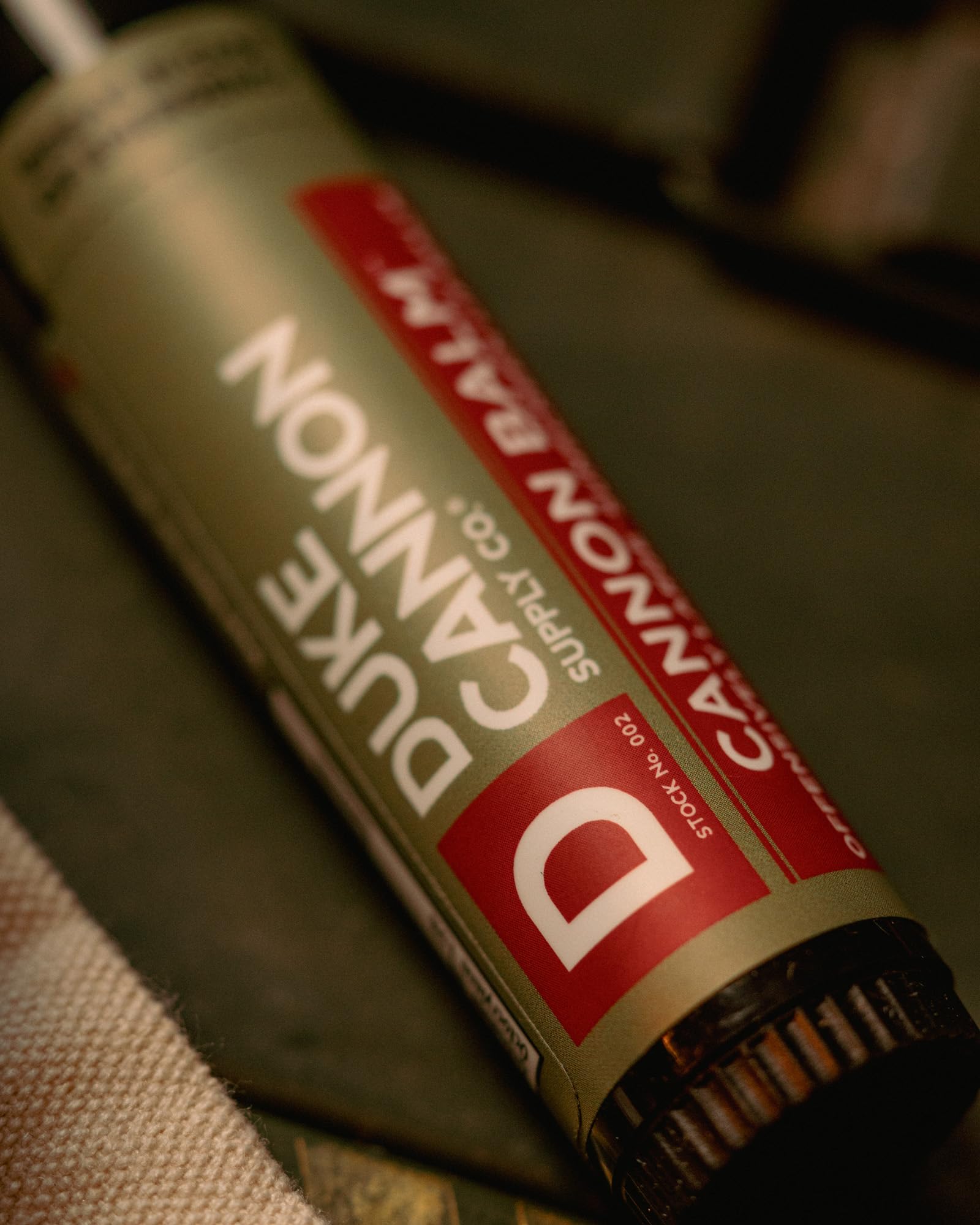 Duke Cannon cap and label detail showing sturdy construction and SPF 15 protection