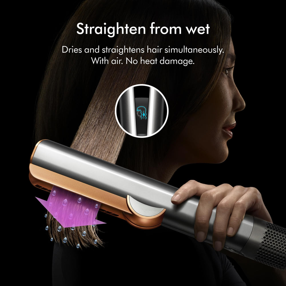 Dyson Airstrait rose gold handle closeup showing ergonomic grip benefit